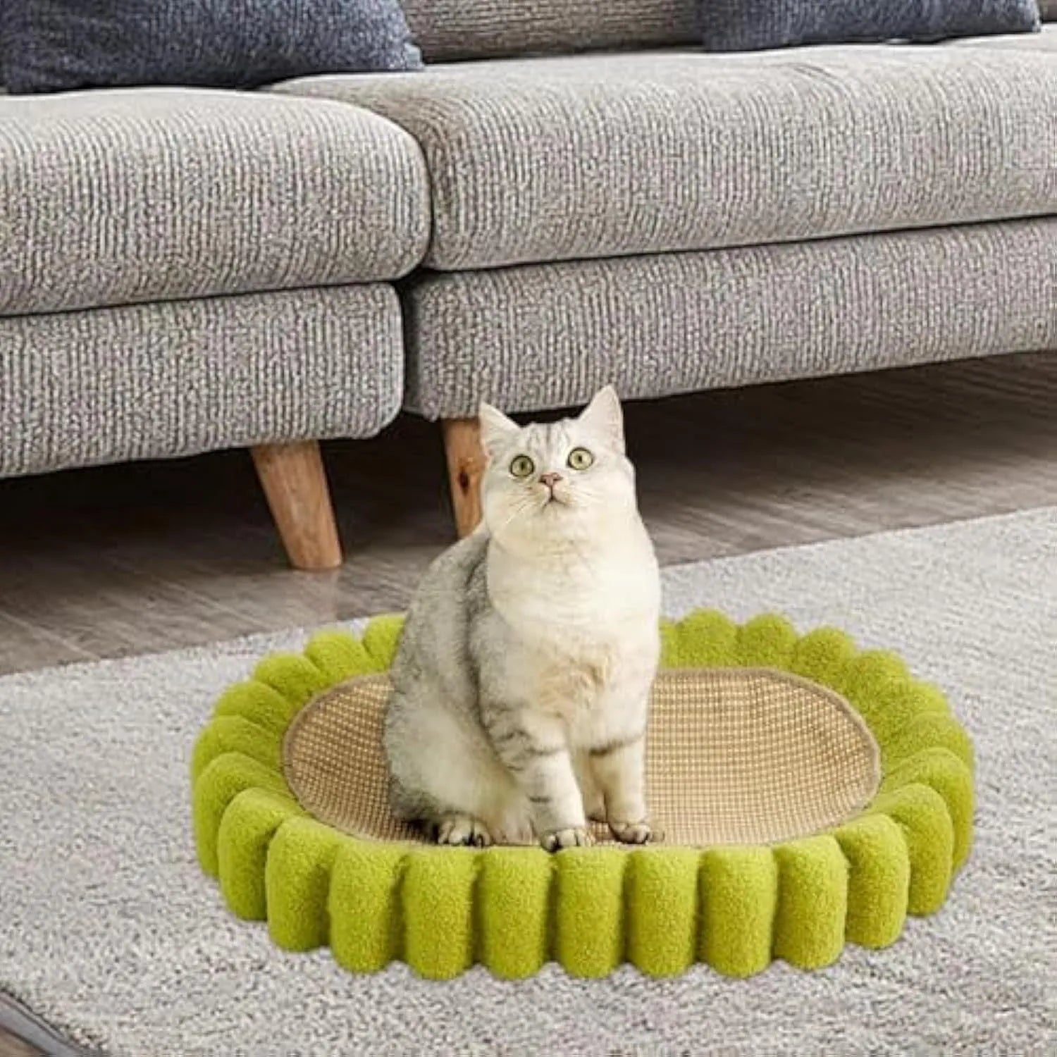Green oval sisal cat scratcher pad bed measuring 650mm by 420mm