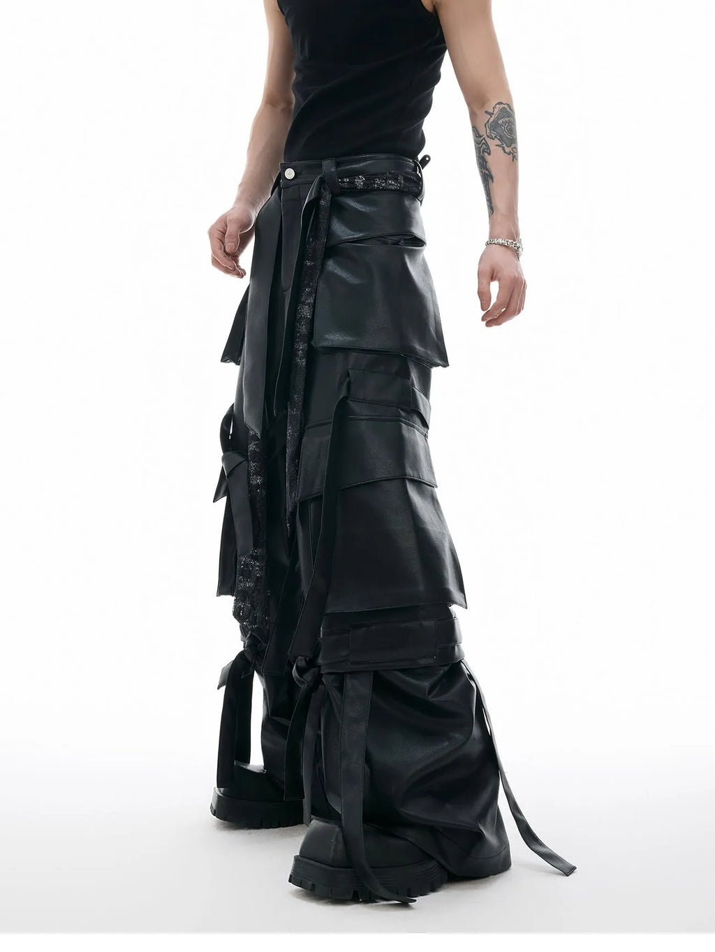Men's black loose fit leather trousers with quilted detailing and multiple pockets