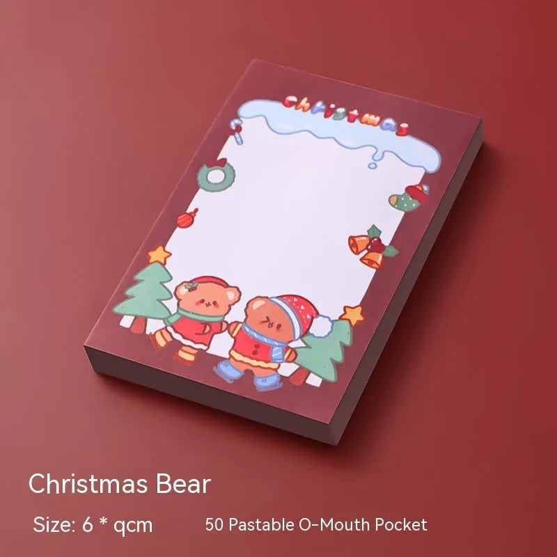 Christmas cartoon sticky notes pad with festive designs including Santa Claus and snowman