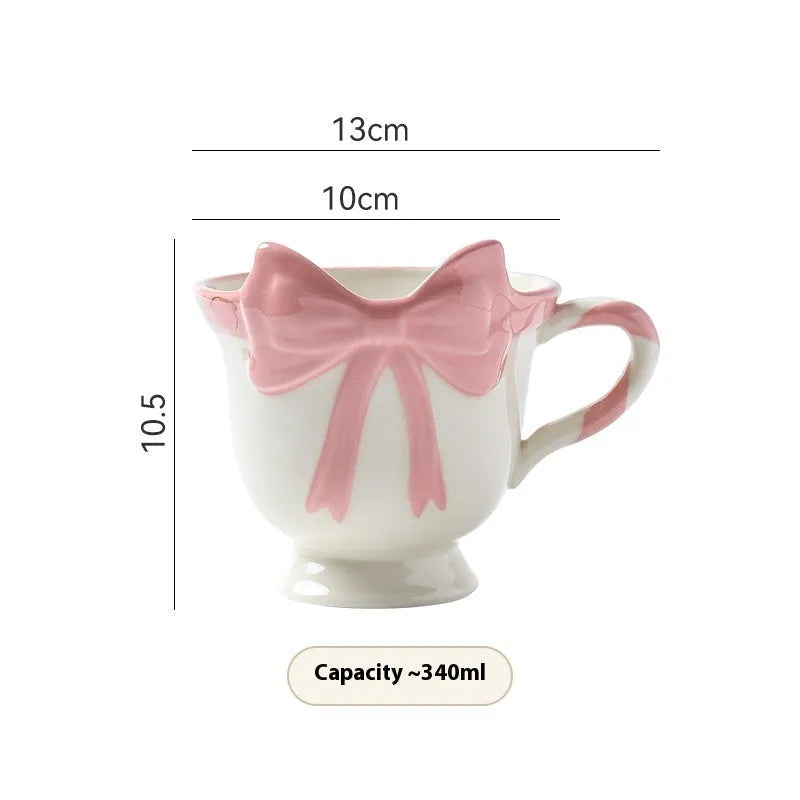 Ceramic heart bow mug with handle in white powder or black pink colour, 330ml capacity