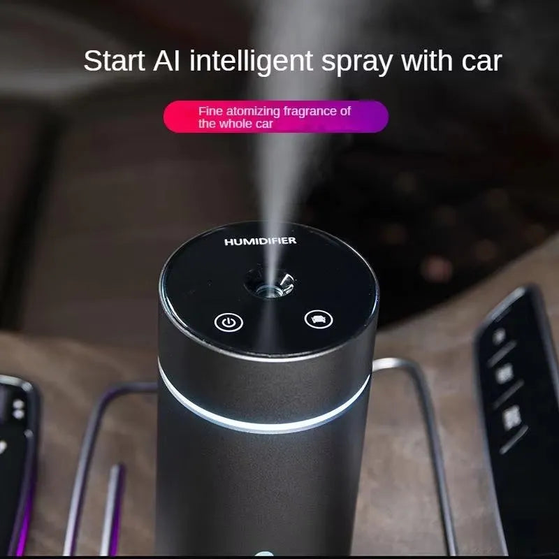 Black portable aluminium car air humidifier and essential oil diffuser with night light on a desk.