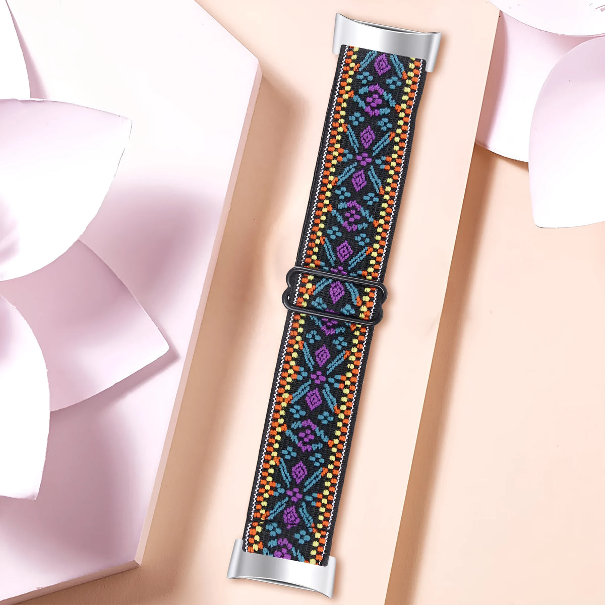Printed elastic replacement watch strap for Fitbit Charge 6 showing adjustable fit and colour options