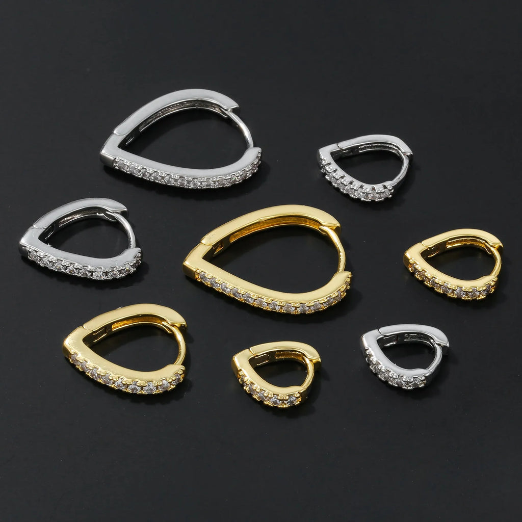 Geometric heart-shaped ear clips in gold and white colours on copper with clip back