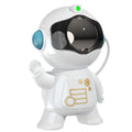 White astronaut starry sky projection lamp with 8 colour options and remote control on a shelf