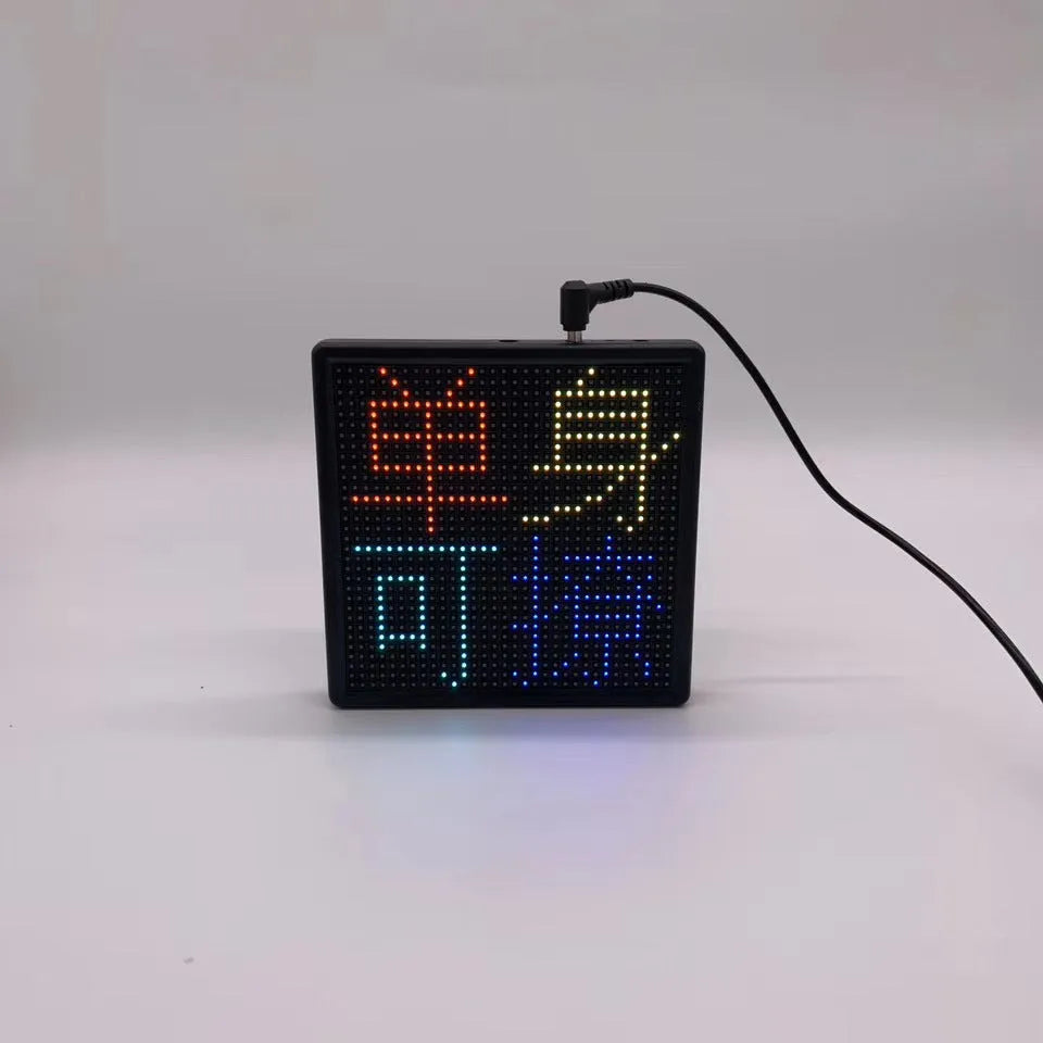 Square LED car display screen with aluminium frame for wireless Bluetooth content updates.