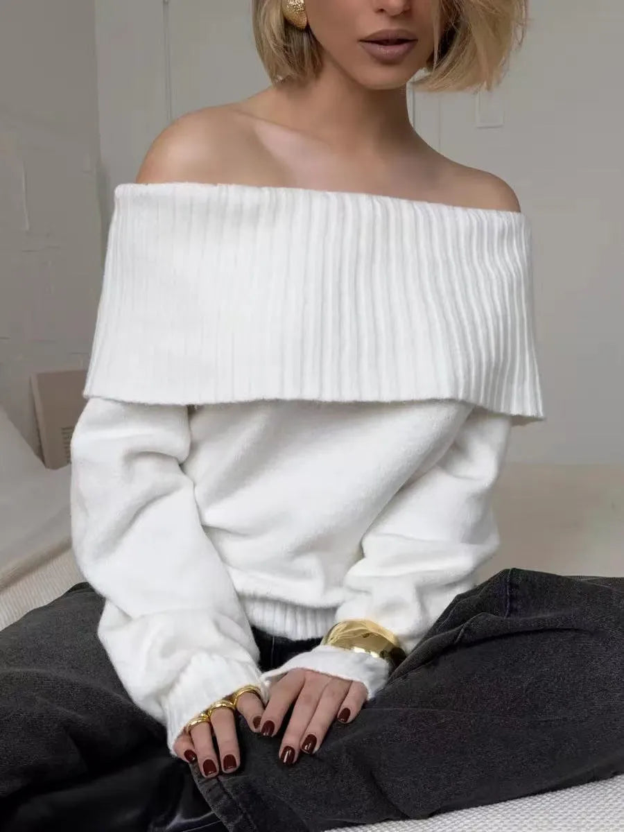 Grey off-the-shoulder strapless sweater with a raised 3D pattern texture.