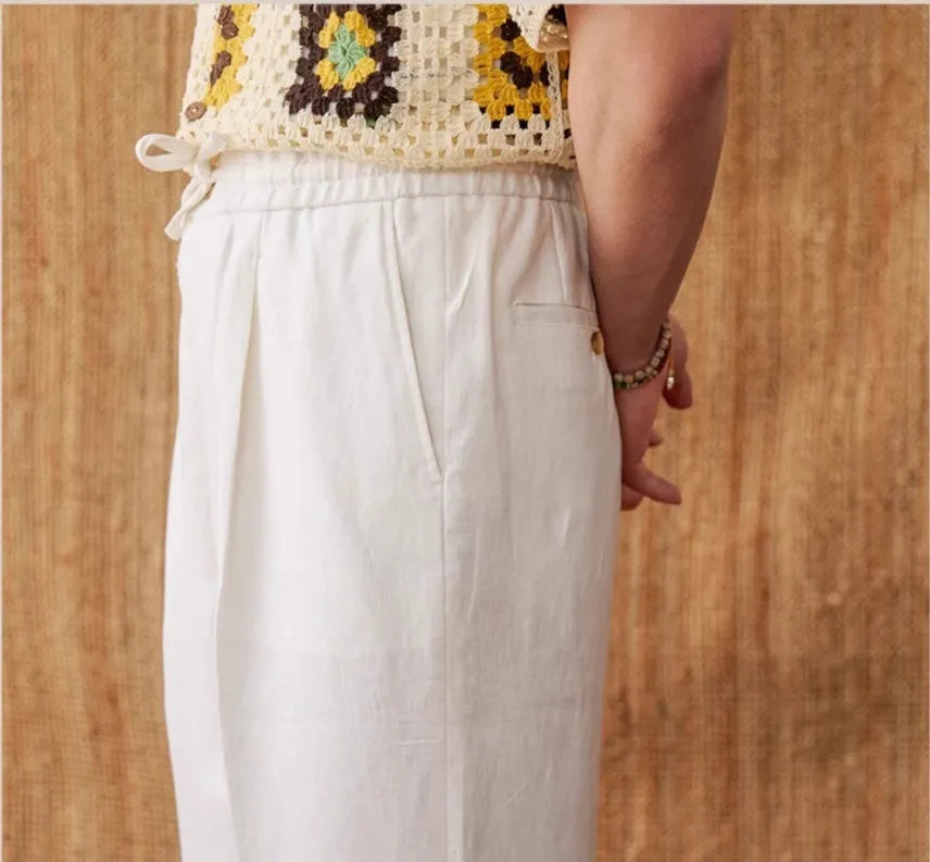 Linen straight-leg trousers with a high elasticated waistband in greige colour.