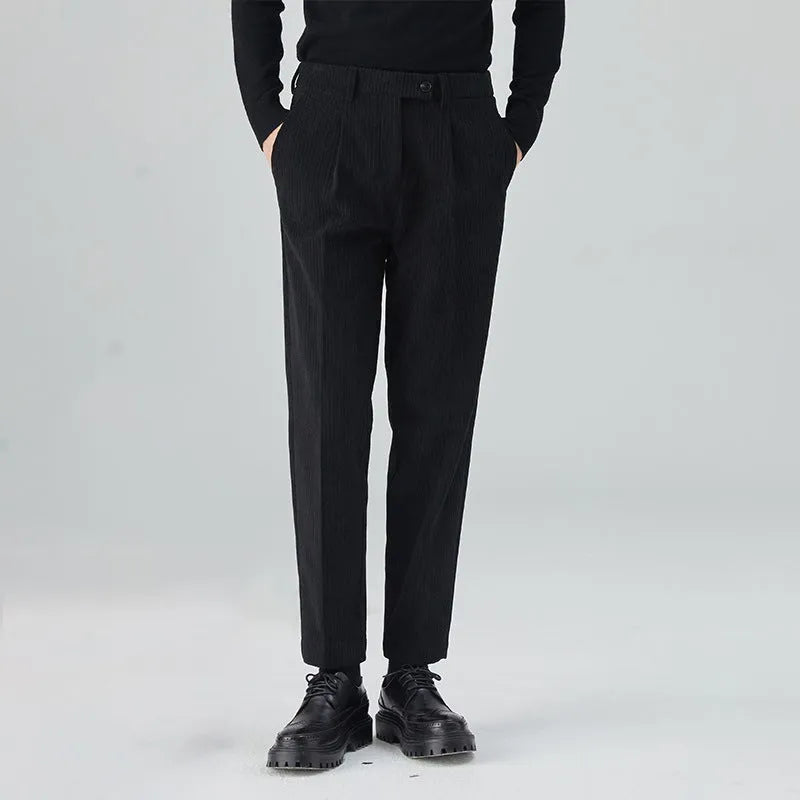 Men's straight-leg corduroy trousers in beige, showing loose fit and textured fabric