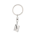 Stainless steel keychain with engraved card inside, shown in silver or gold envelope style