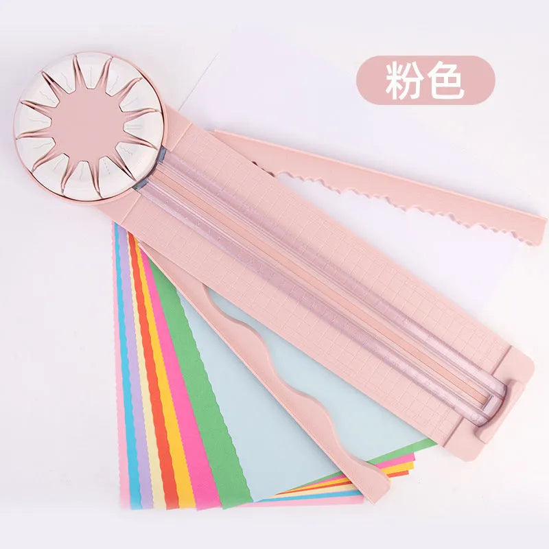 12-in-1 plastic paper cutting machine with dotted board in pink or black, measuring 46.2 cm long