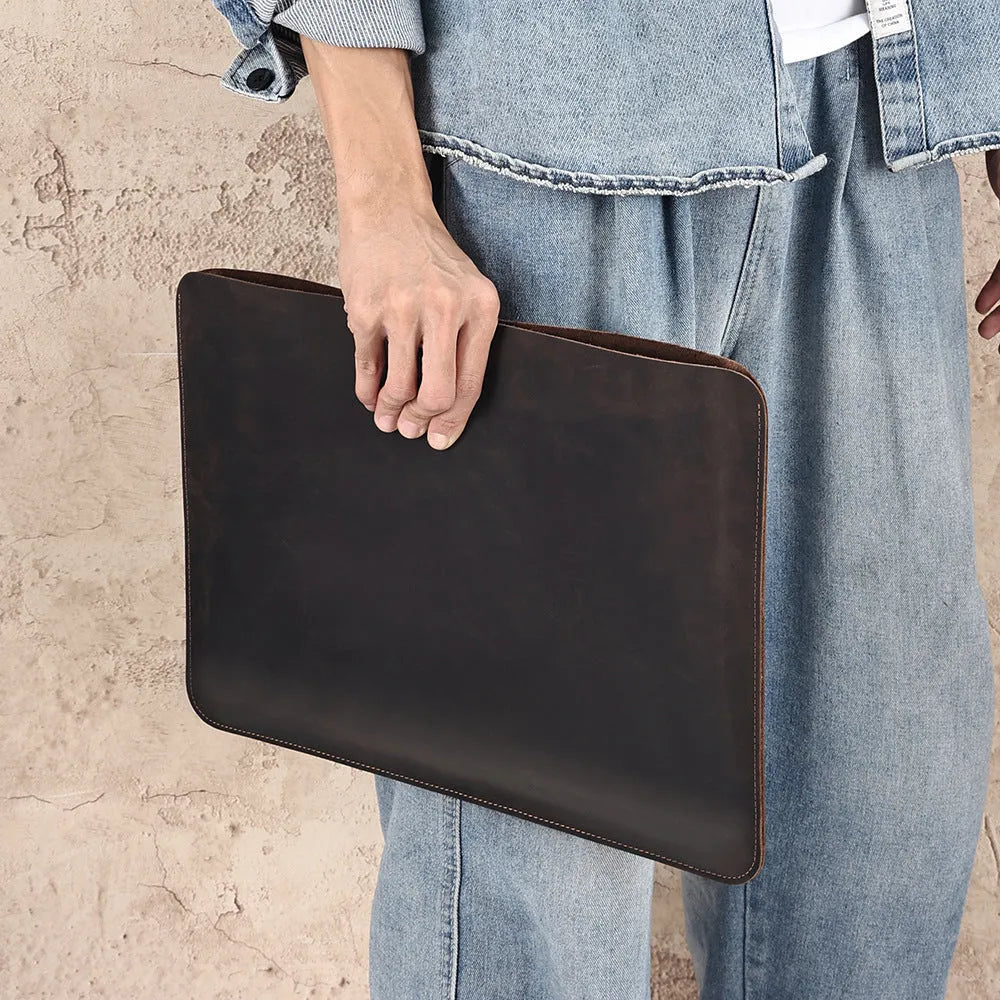 Brown genuine crazy horse leather computer bag with lined interior shown in medium and large sizes