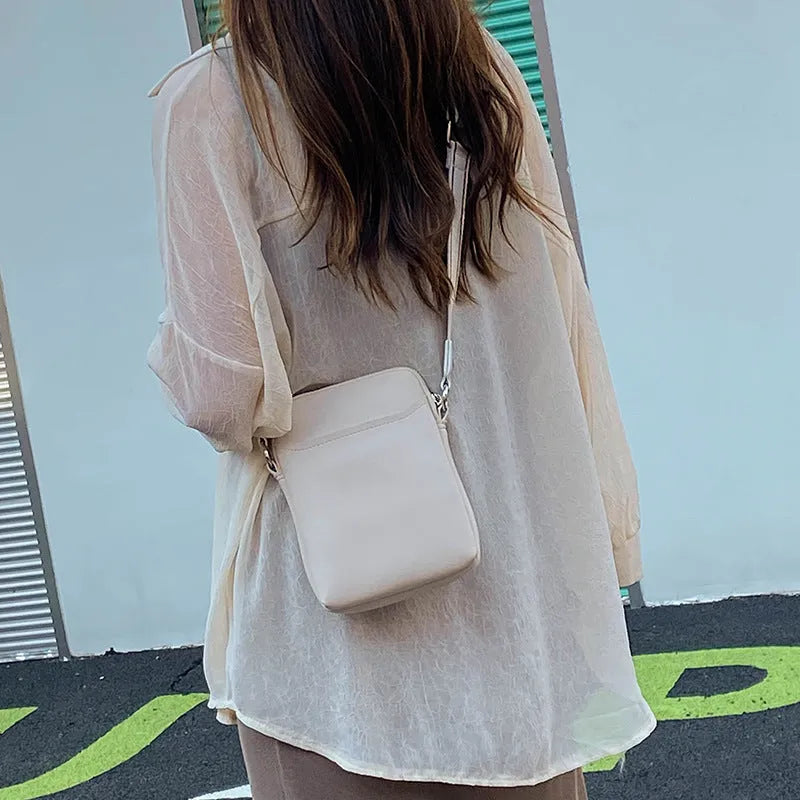Solid colour mobile phone crossbody shoulder bag for women in PU material showing black, beige, khaki, and green colour options
