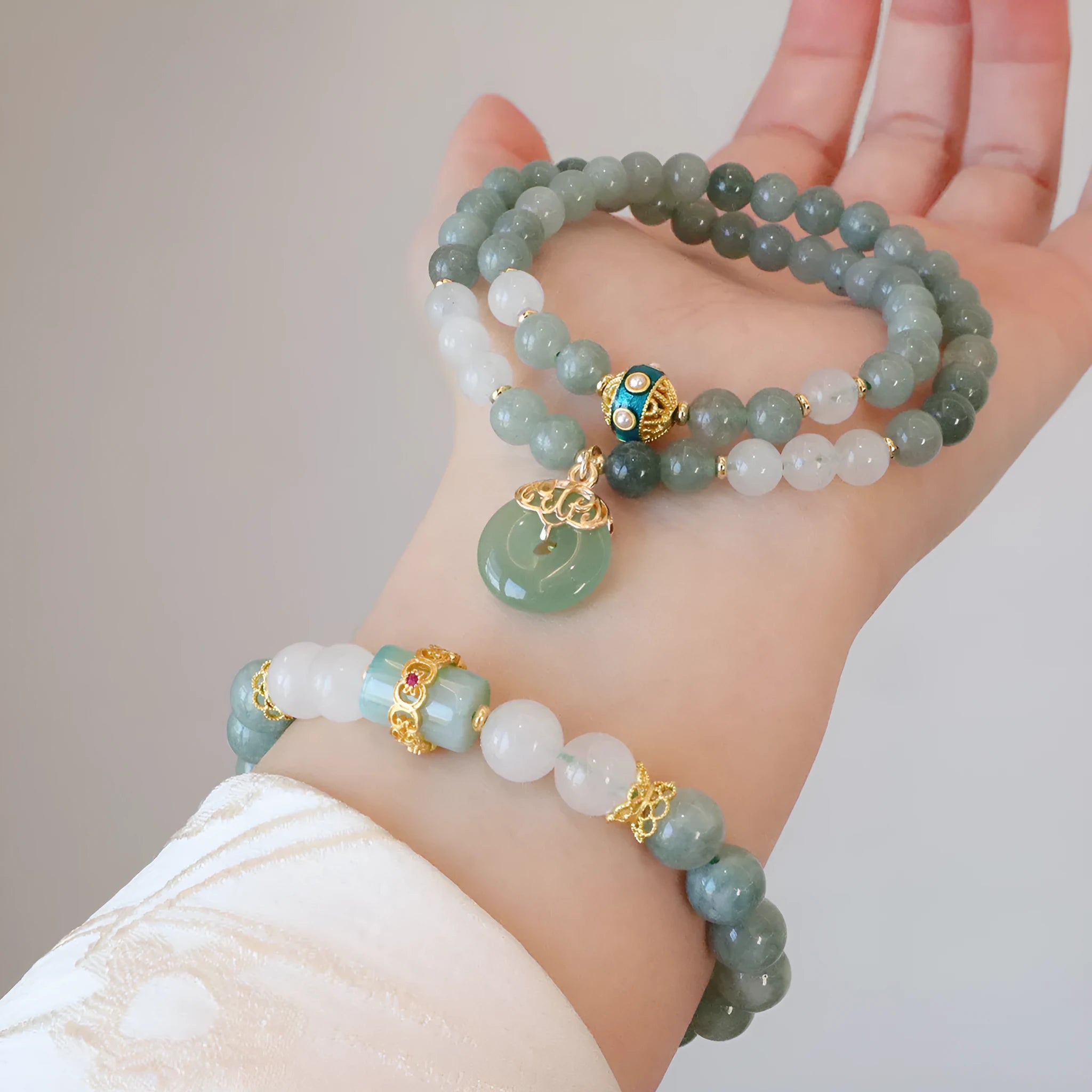 Women's jade safety buckle bracelet with geometric beads and traditional peace buckle clasp.
