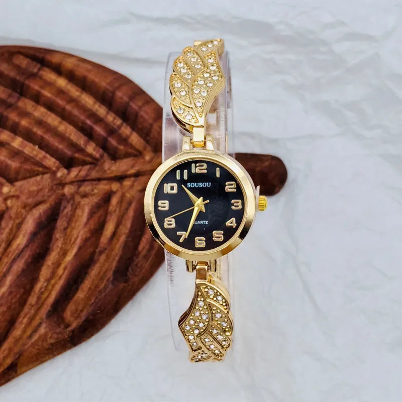 Round stainless steel women's watch with gold dial surface and Vachette clasp buckle