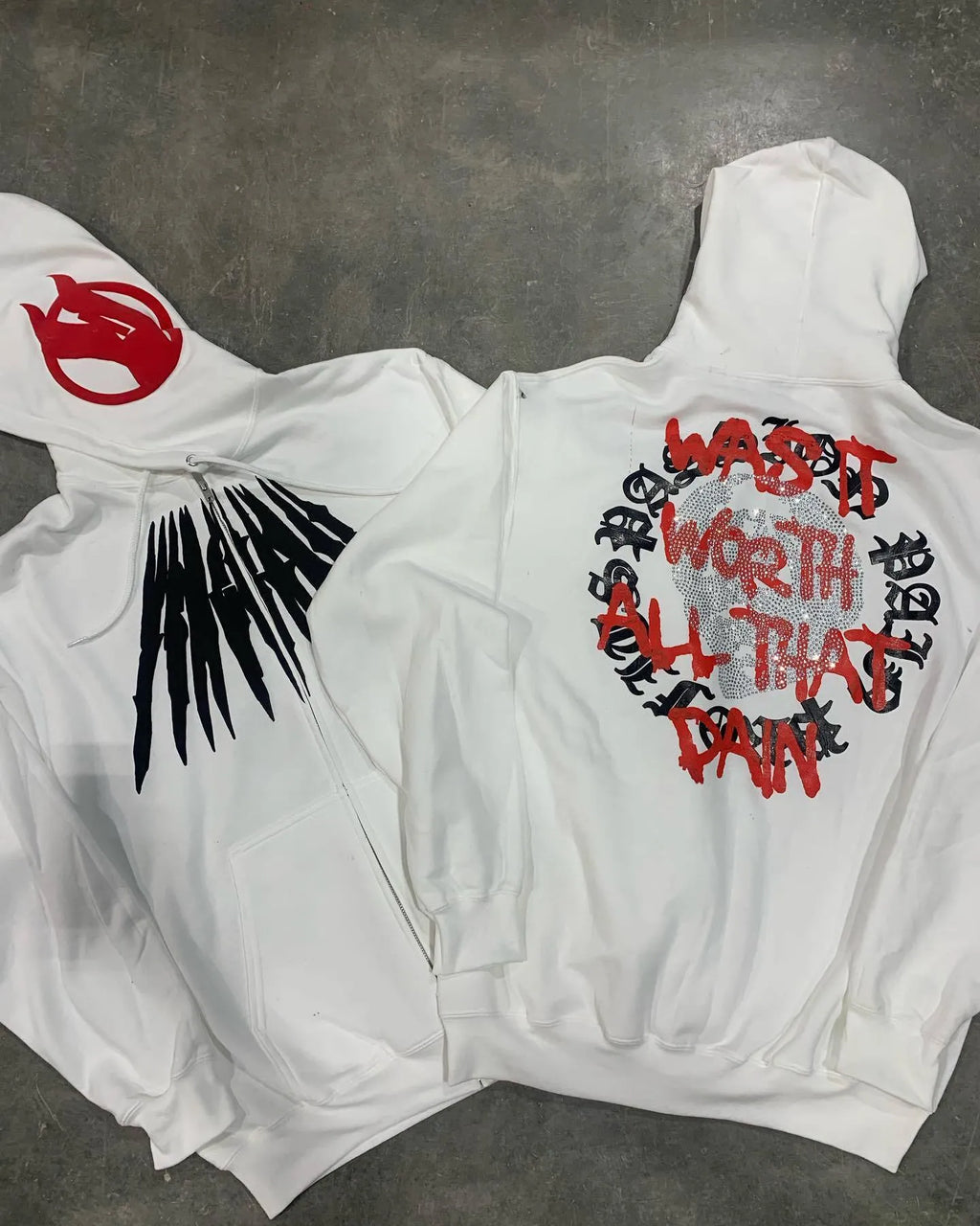 Black loose hooded sweatshirt with printed skull and rhinestone design