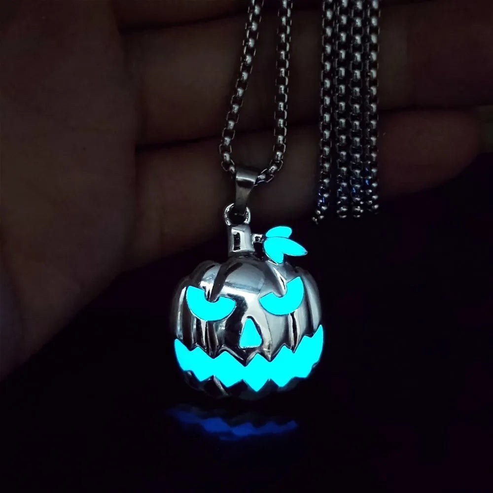 Luminous pumpkin pendant necklace with ghost face design glowing in the dark