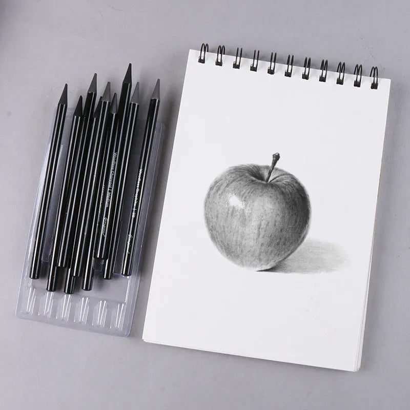 Carbonised and graphite drawing pencil set of nine in a wooden case, showing six graphite and three carbonised pencils.