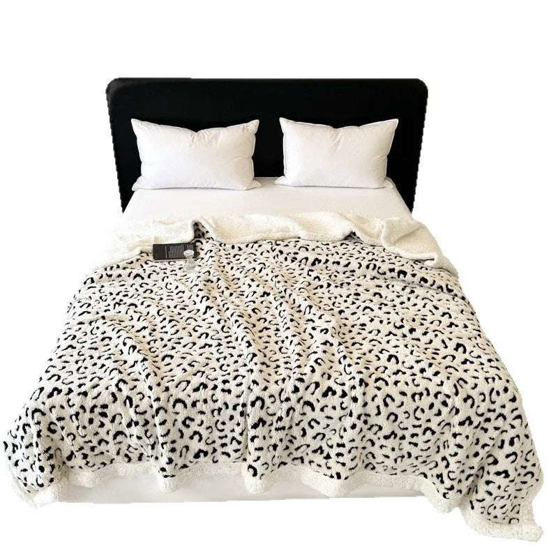 Double-layer taffeta blanket with reversible leopard jacquard print design shown in camel colour