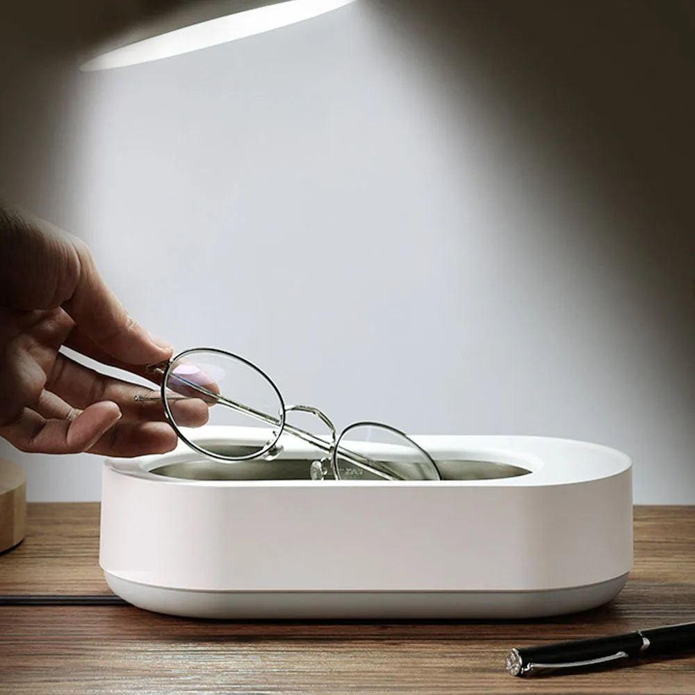 White portable ultrasonic cleaning machine with display and stainless steel tank.