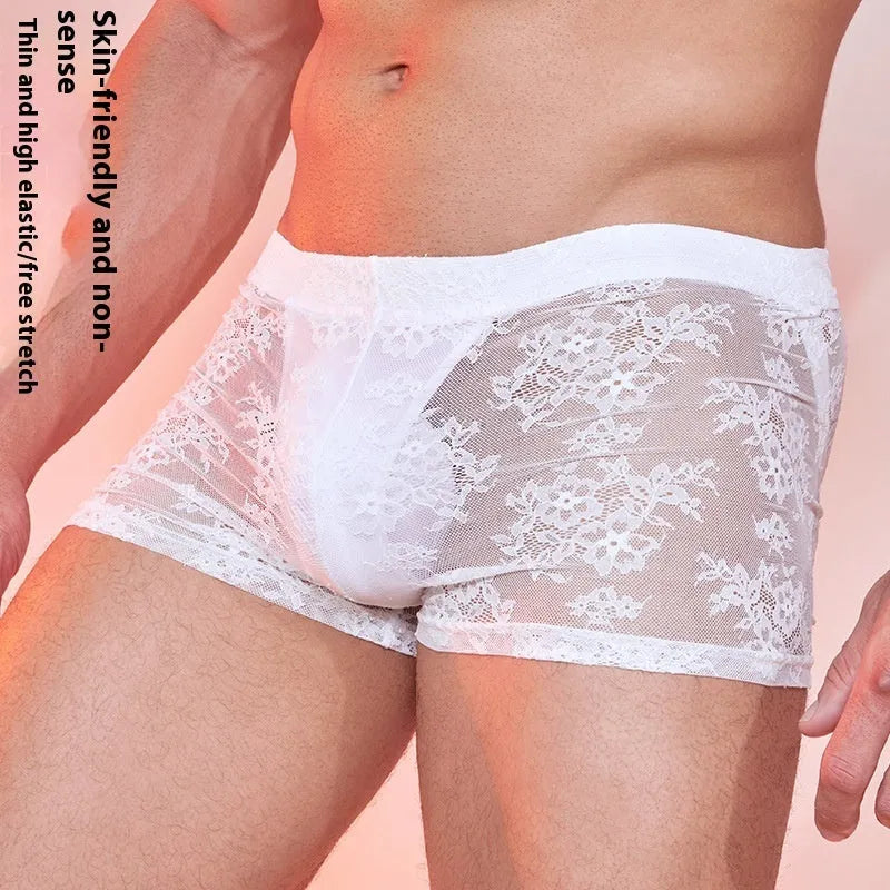 Men's black boxer shorts with a white lace trim detail around the leg openings.