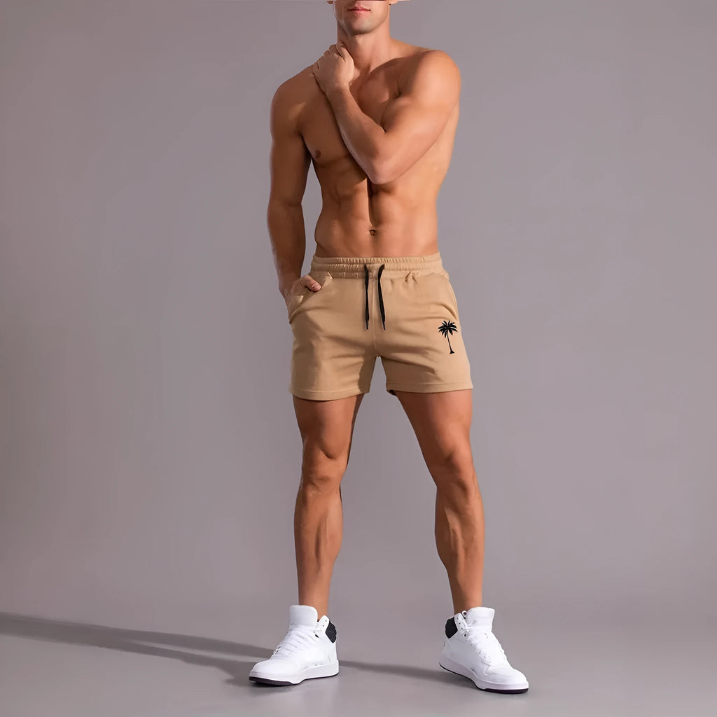 Khaki men's coconut print sports shorts with straight leg and elastic waistband