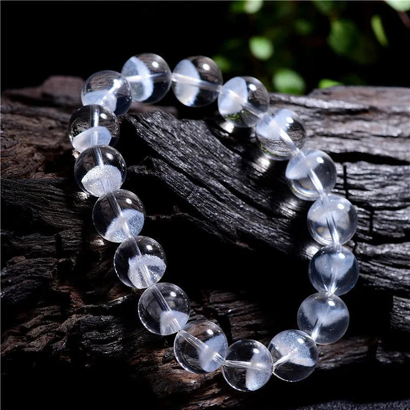 Women's white crystal ghost pyramid bracelet with ruyi element on wrist