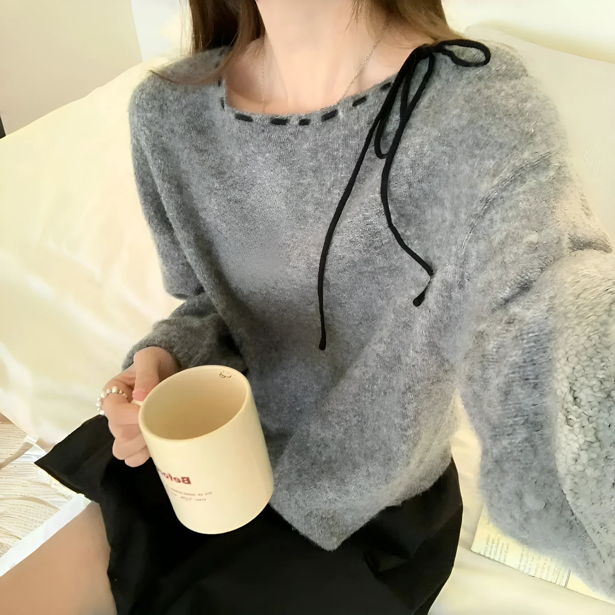 Women's grey loose-fitting pullover knitwear with relaxed sleeves and crew neck