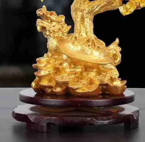 Citrine-coloured resin money tree ornament with a small turtle, measuring 18 by 23 cm.