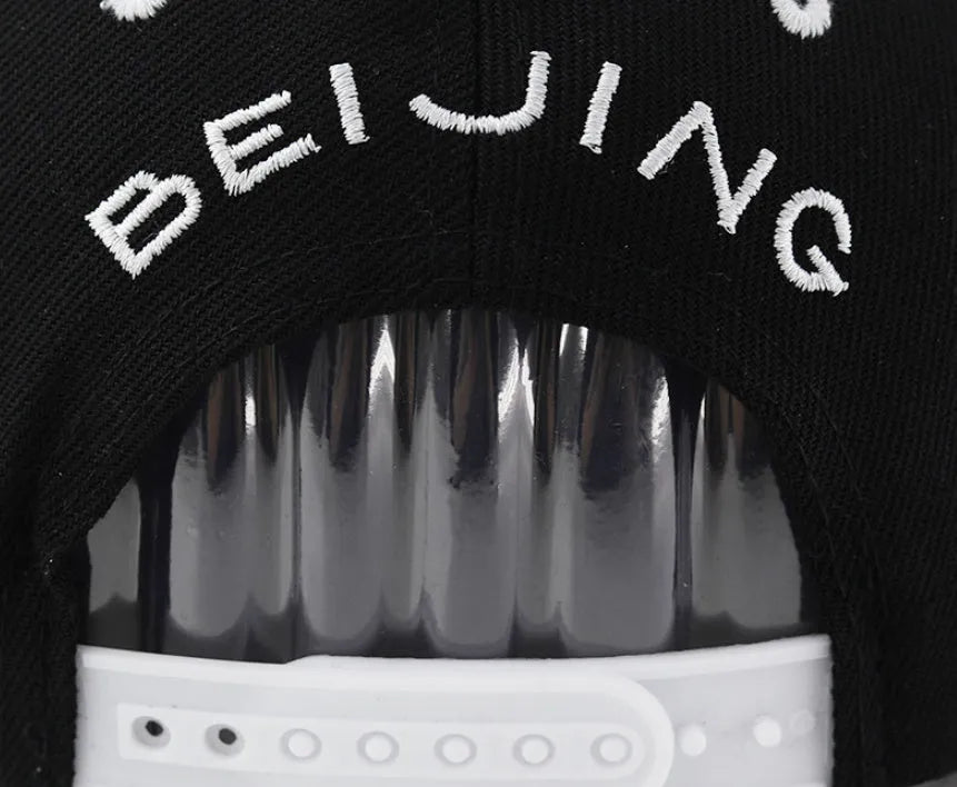 Cotton baseball cap with letter embroidery in black or white with adjustable strap