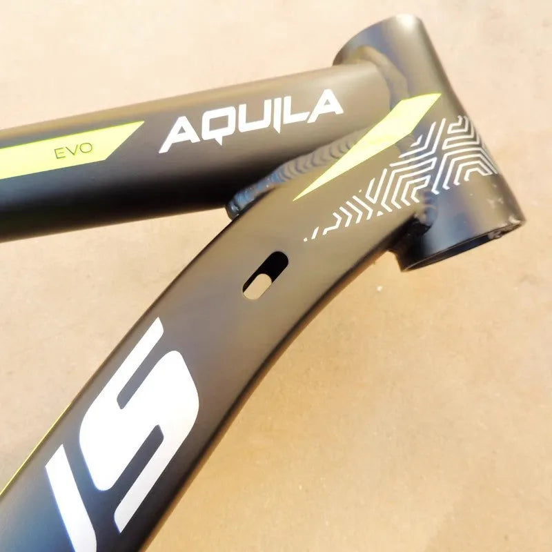 Black green aluminium mountain bike frame for 29-inch wheels with internal cable routing and disc brake mounts.