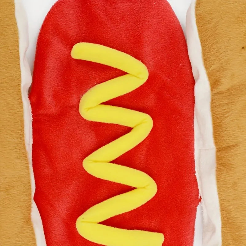 Brown and beige hot dog costume on a small dog, showing plush bun, sausage, and fabric mustard and ketchup toppings.