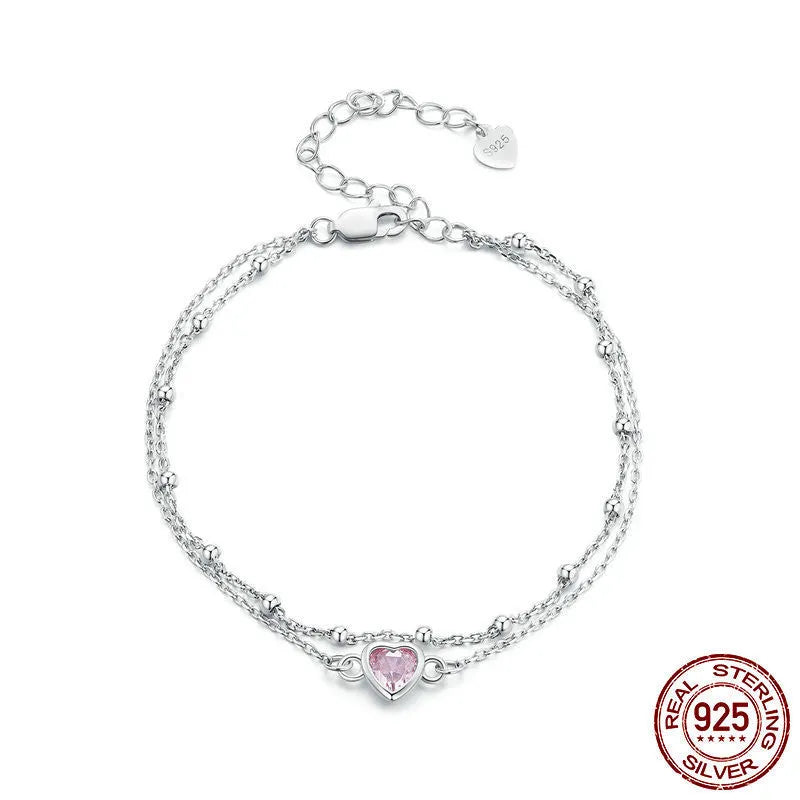 Women's 925 sterling silver bracelet with a small heart-shaped pendant on an adjustable chain.