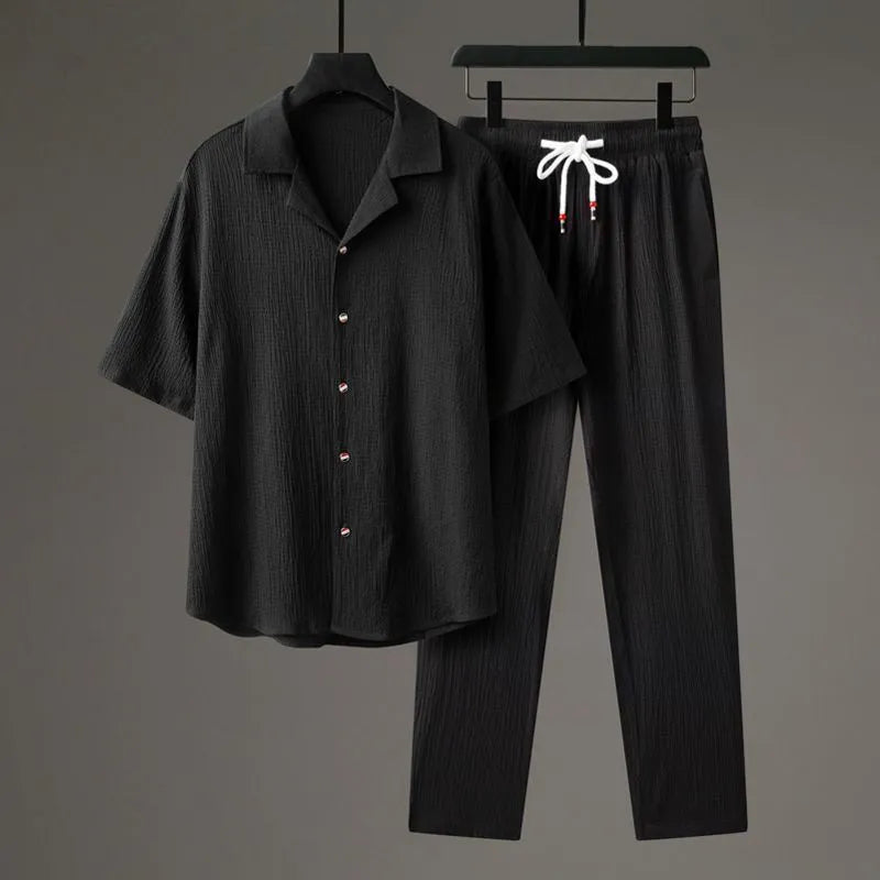 Men's Chinese style two-piece knitwear set showing short-sleeved top and trousers in polyester fabric