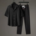 Men's Chinese style two-piece knitwear set showing short-sleeved top and trousers in polyester fabric