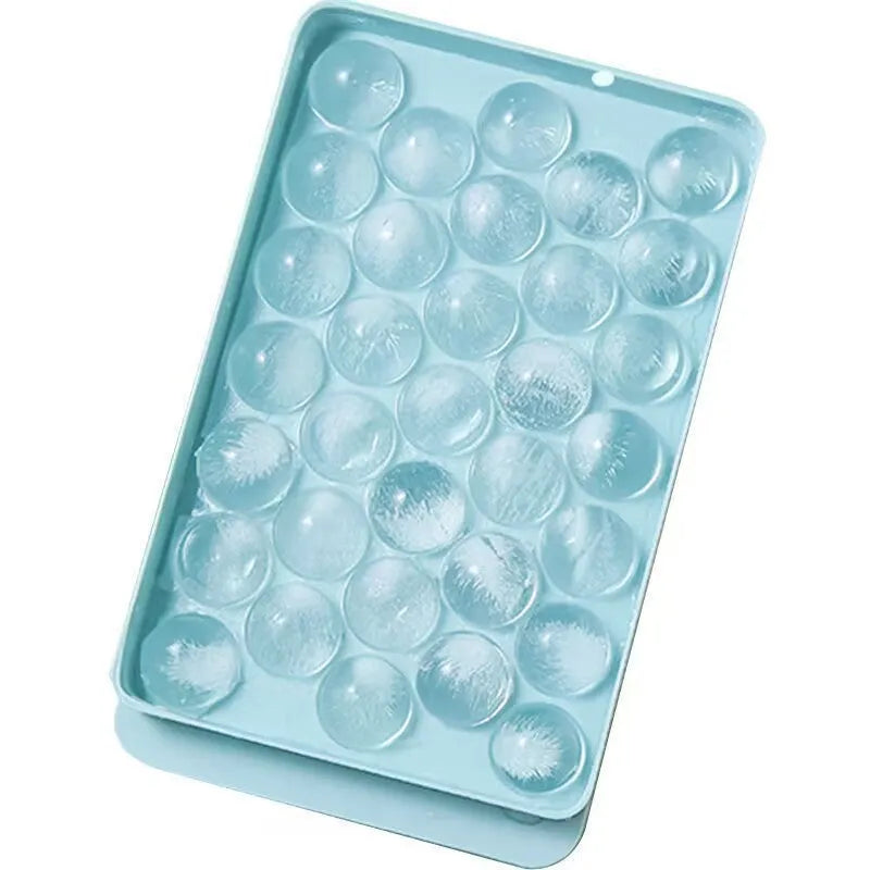 Blue silicone ice cube tray with lid showing 33 round grids for homemade ice