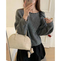 Women's grey loose-fitting pullover knitwear with relaxed sleeves and crew neck