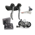 Road bike transmission kit with aluminium manual shift lever, front dial, and short leg rear derailleur.