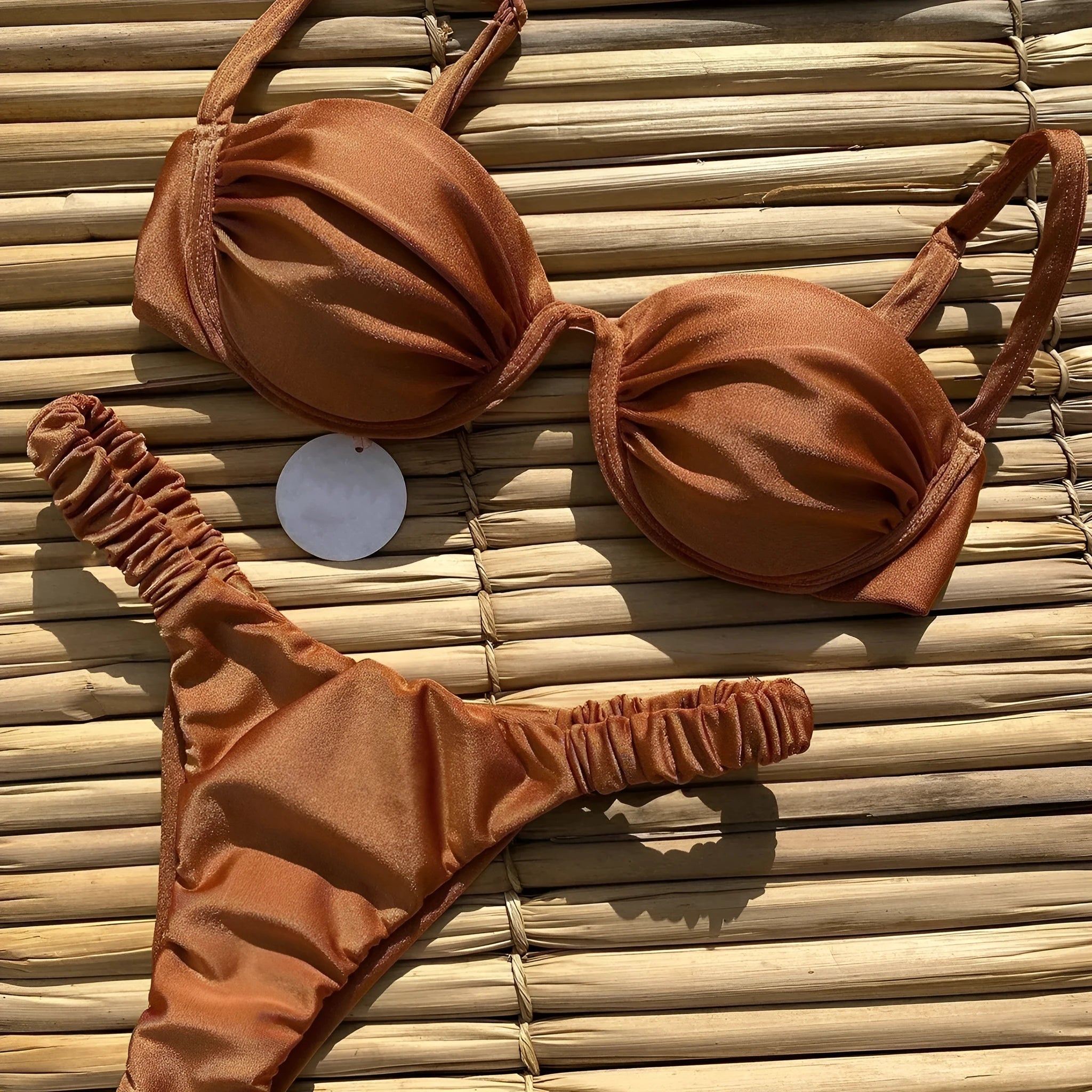 Women's black underwire bikini swimsuit set on a hanger.
