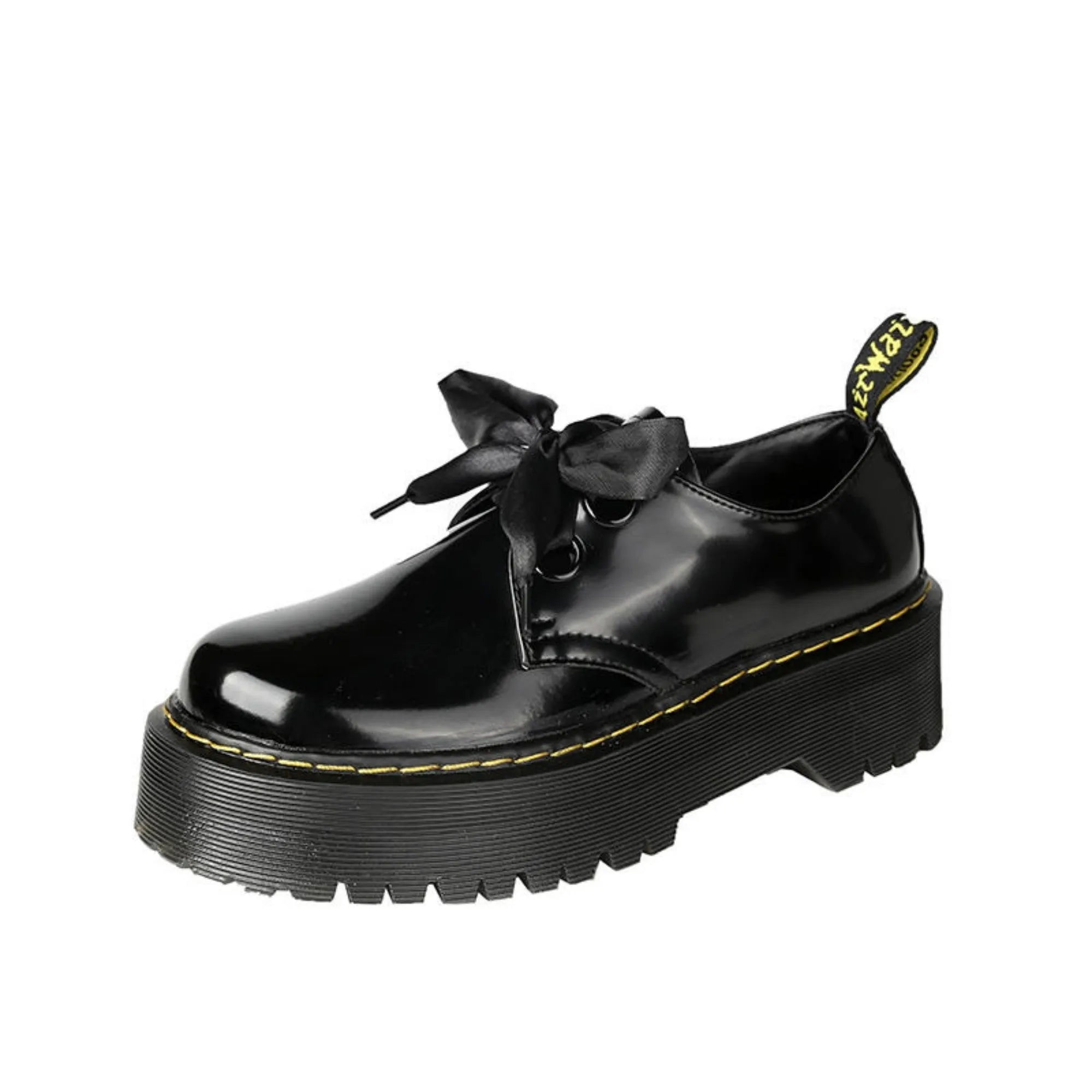 Black thick soled women's lace-up shoes with ribbon and cross strap details on a white background.