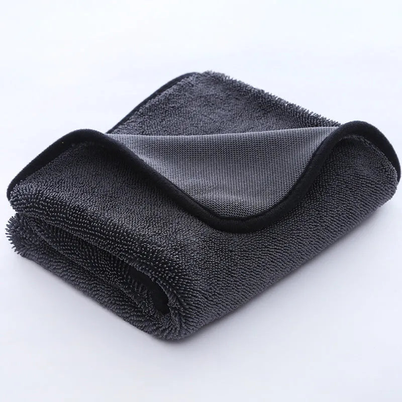 Small braid twisted car cleaning towel in grey with red edge trim, showing textured surface