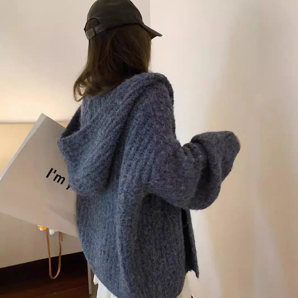 A loose-fit, thick acrylic hooded cardigan sweater for women, shown in a macaron colour.