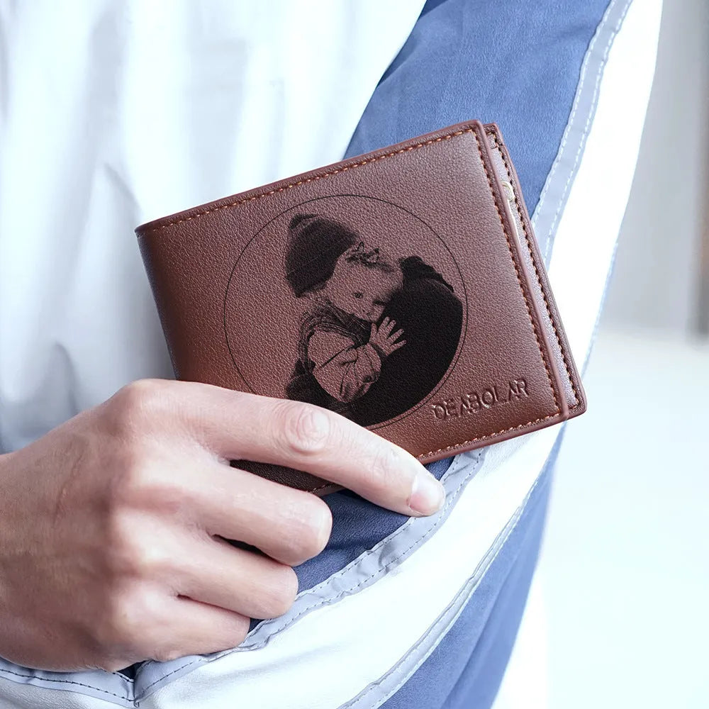 Men's brown leather wallet with a silver zipper closure, shown with individual packaging.