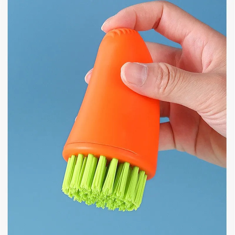 Carrot-shaped orange kitchen brush with nylon bristles for cleaning vegetables