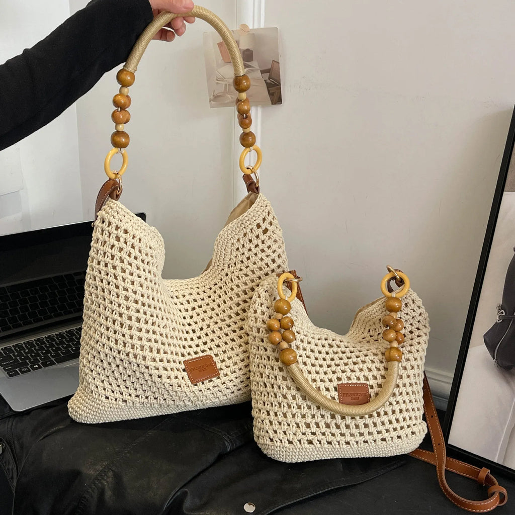 Knitted tote beach bag showing bucket shape, contrast stitching, and crossbody strap