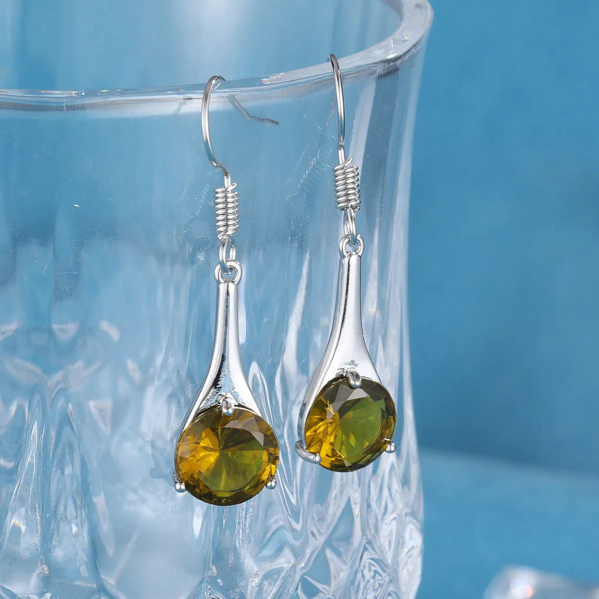 Olive green topaz drop earrings with minimalist water drop shape and retro style