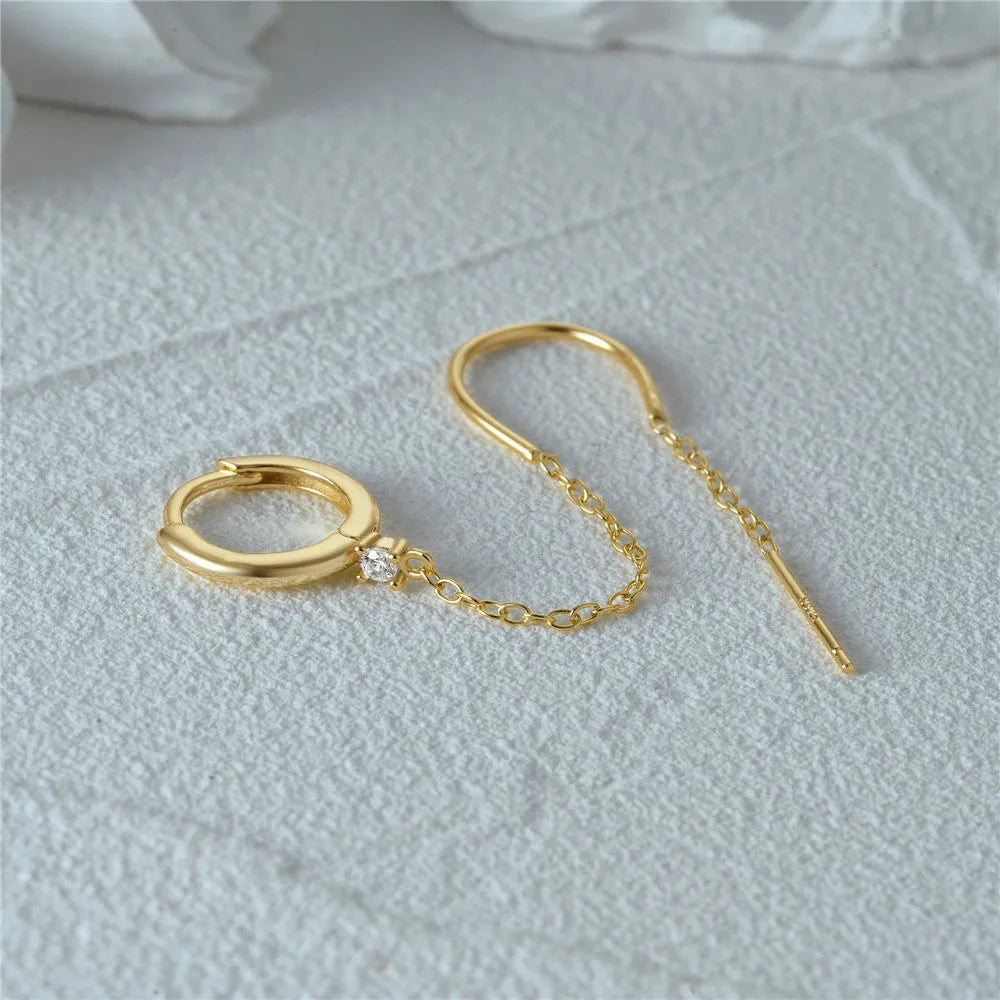 S925 sterling silver ear stud with flower, chain, and tassel detail in a golden electroplated finish.