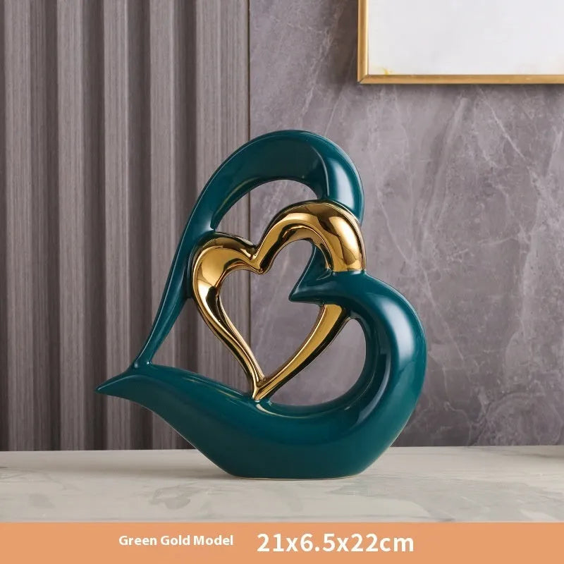 Modern white porcelain Love Heart ornament with a geometric design in a metallic gold finish.