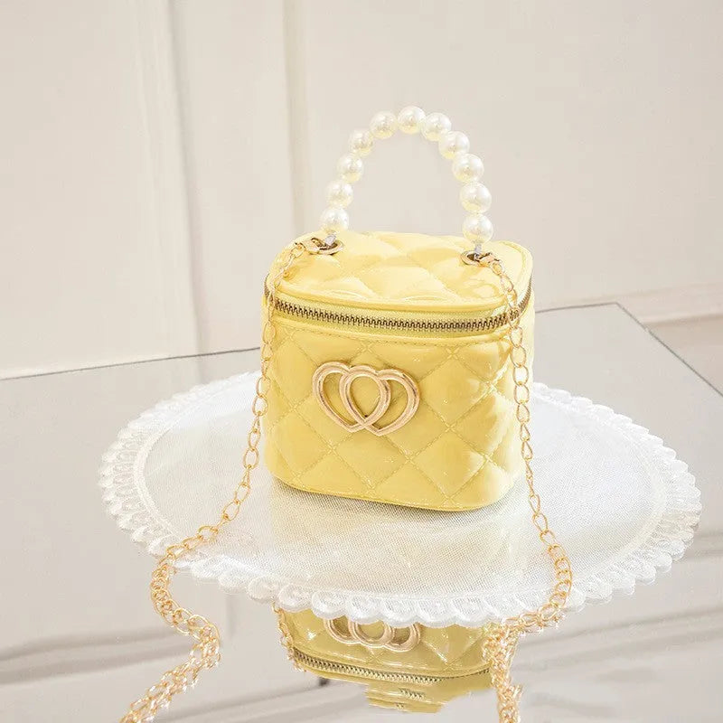 White PVC bucket handbag with a heart-shaped pattern