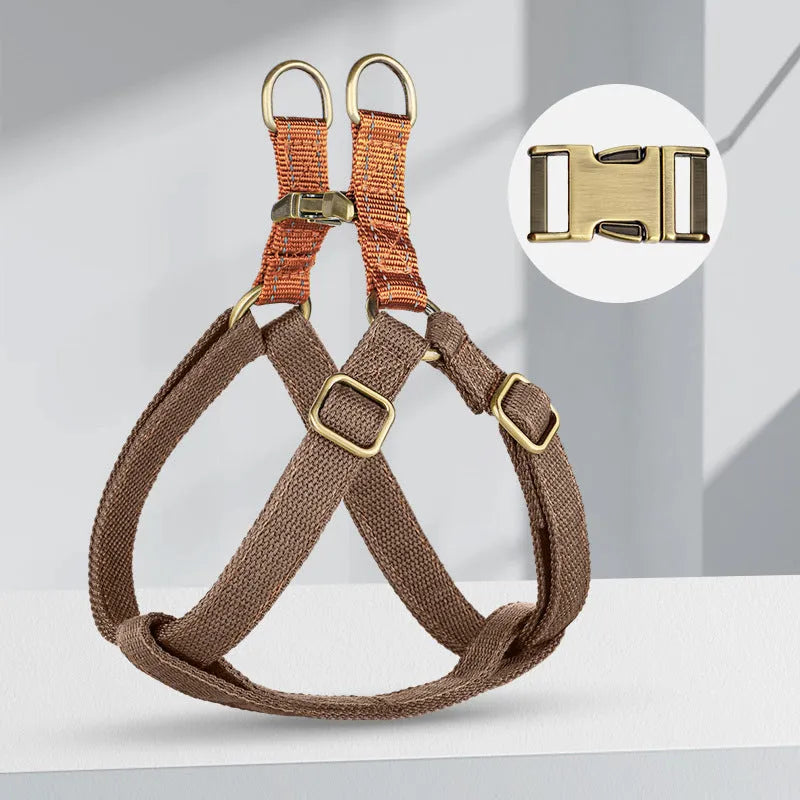 Brown vest-style dog leash on small dog showing chest strap and alloy fastener