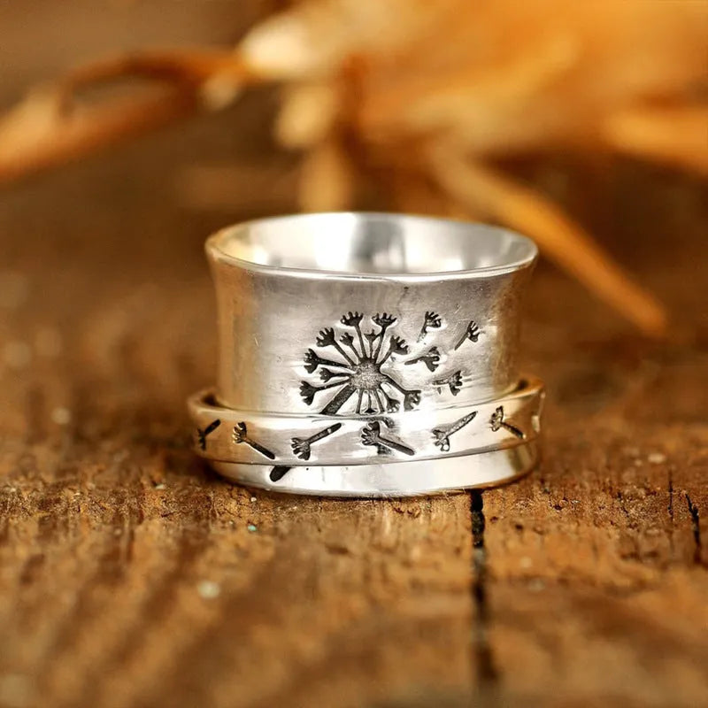 Silver colour alloy flower ring with rotatable design elements showing floral shape in sizes 7-11